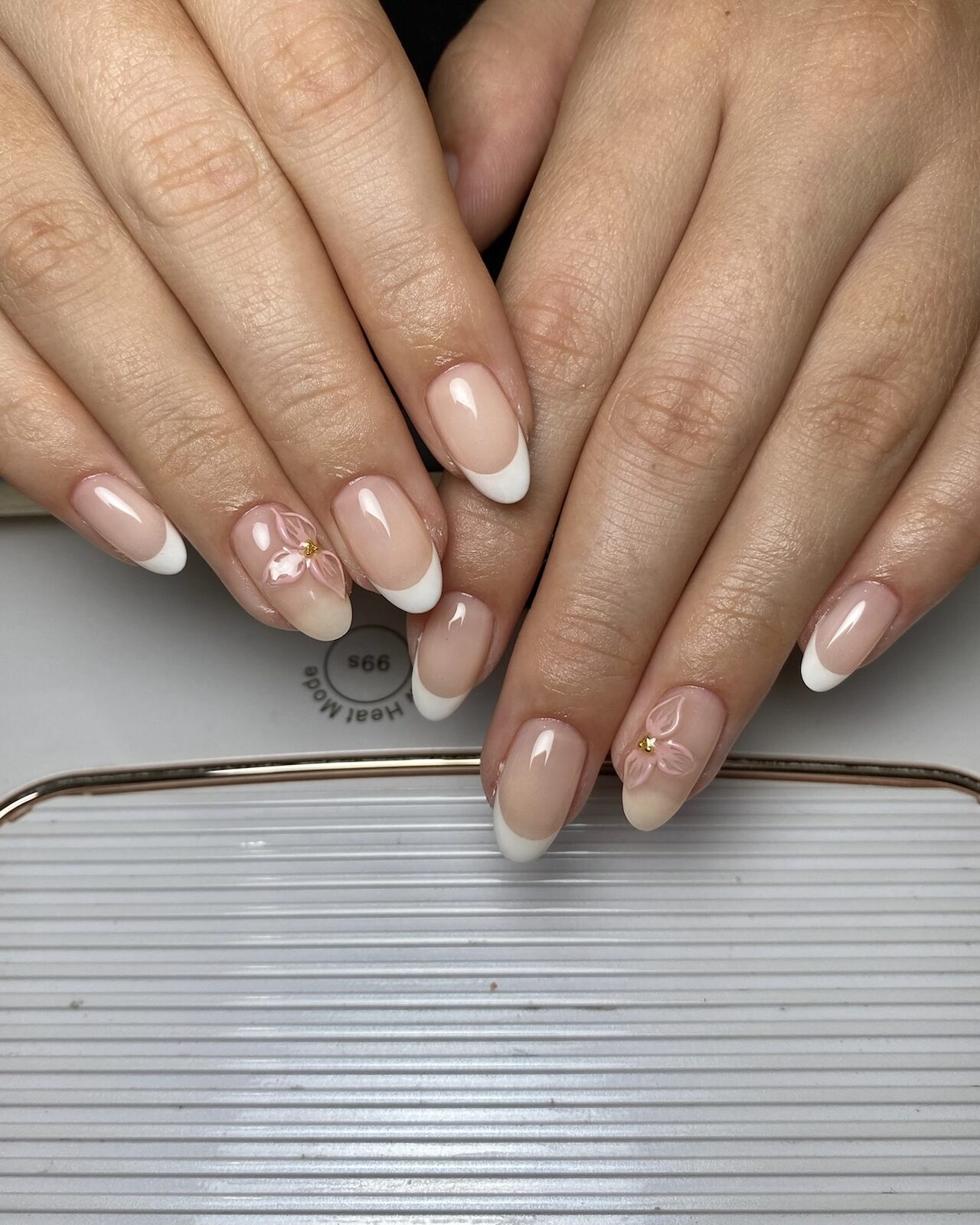 French manicure with three-dimensional white florals